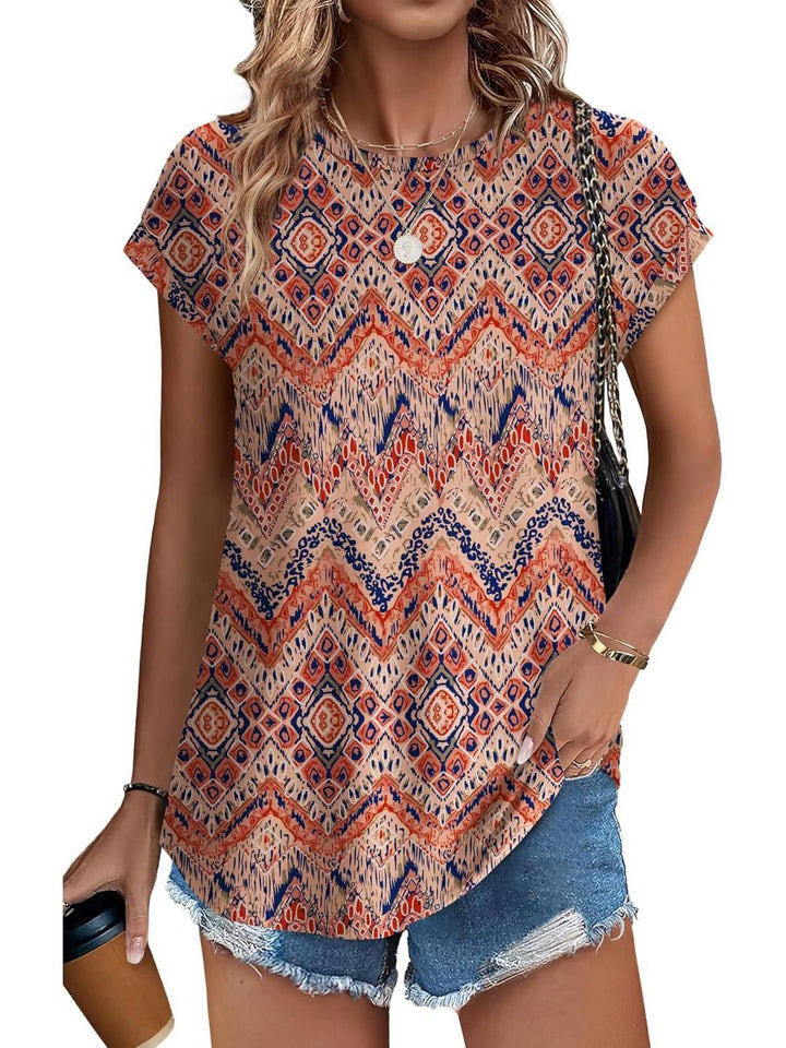 Close-up neckline detail of women's crew neck cap sleeve botanical print top