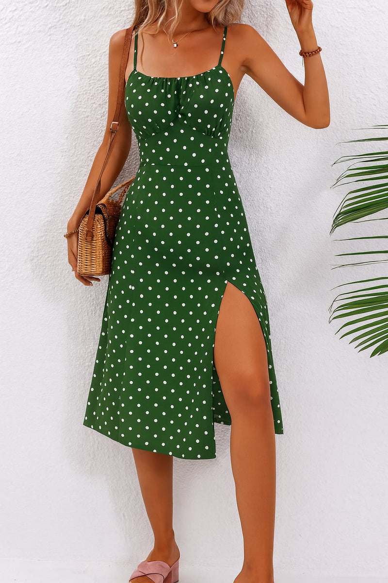 Lime green polka dot midi dress with gathered bust displayed on a model outdoors