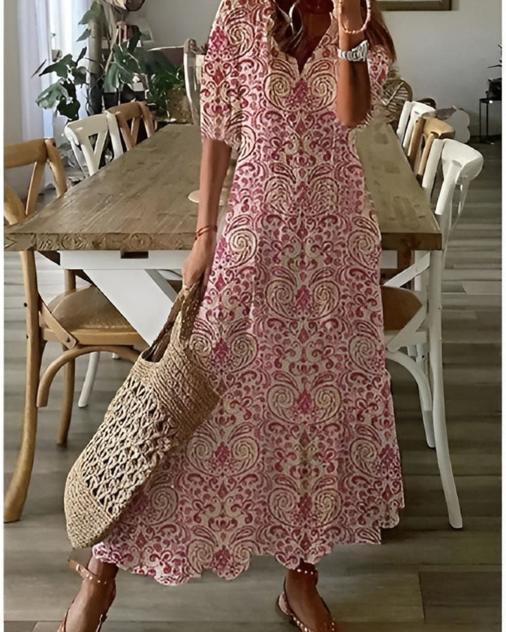 Woman styling the boho dress with sandals for a casual summer beach look