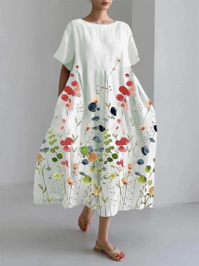 Woman wearing a white casual floral long dress with a relaxed flowing silhouette, perfect for summer