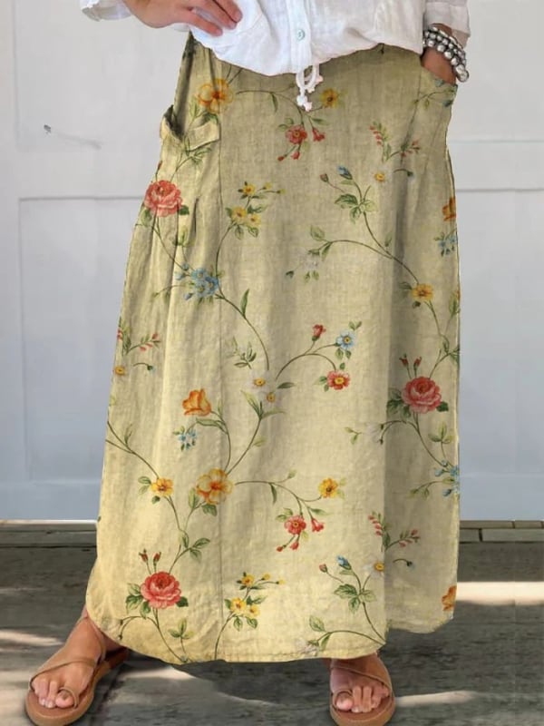 Woman wearing a retro floral A-line skirt with elastic waistband in beige, front view