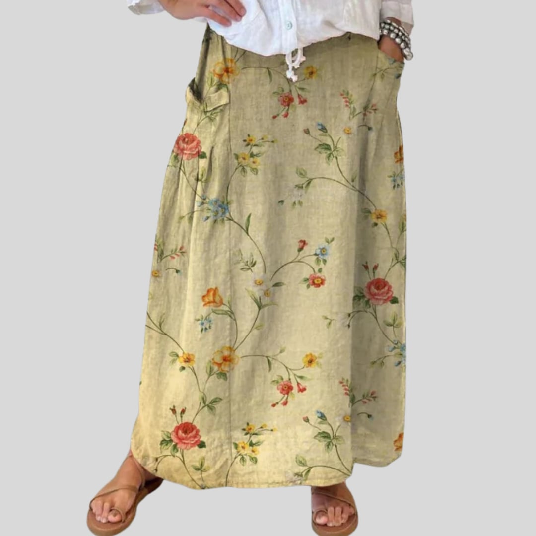 Side view of retro floral A-line skirt showing deep side pocket and flowing silhouette