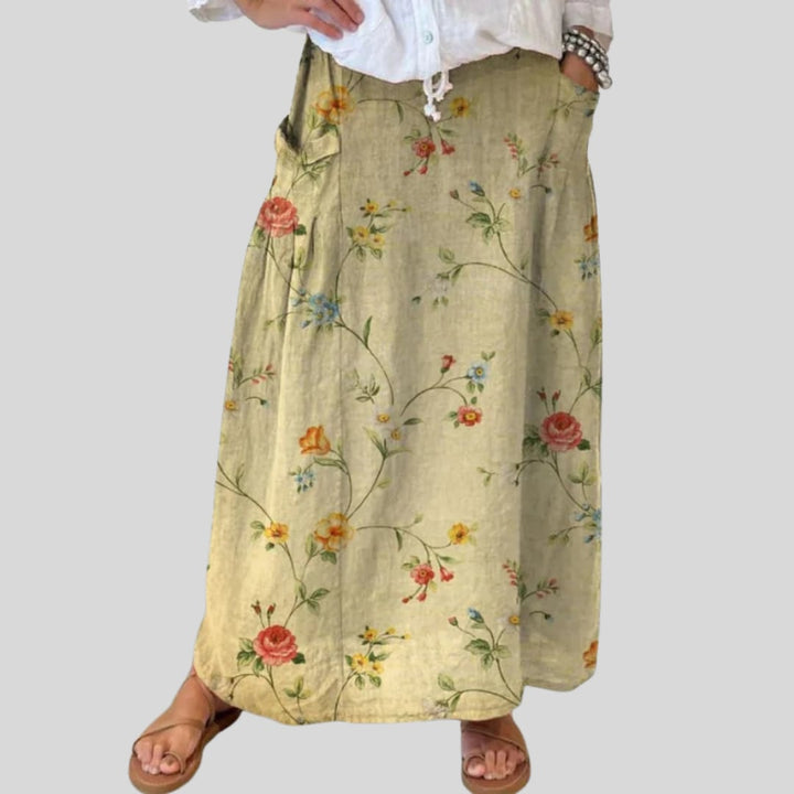 Side view of retro floral A-line skirt showing deep side pocket and flowing silhouette