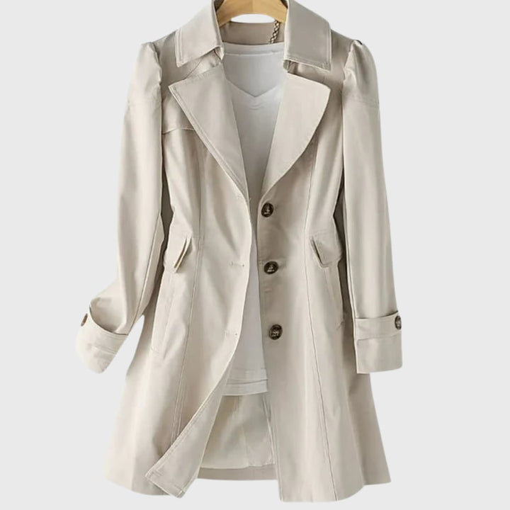 Woman wearing a lightweight water-resistant everyday rain coat in a relaxed tailored fit, shown from the front