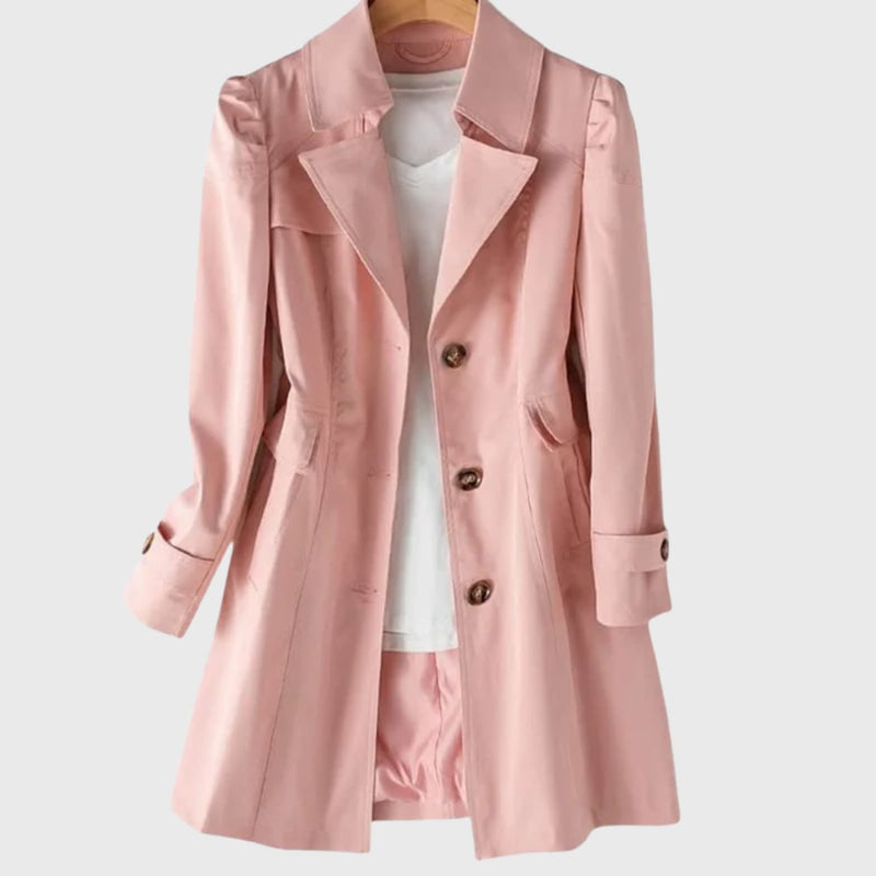 Flat lay of the everyday rain coat showing the full length and structured shoulders