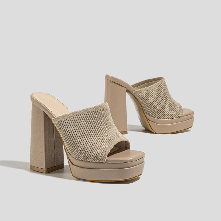 Merle platform sandals in black on a clean white background