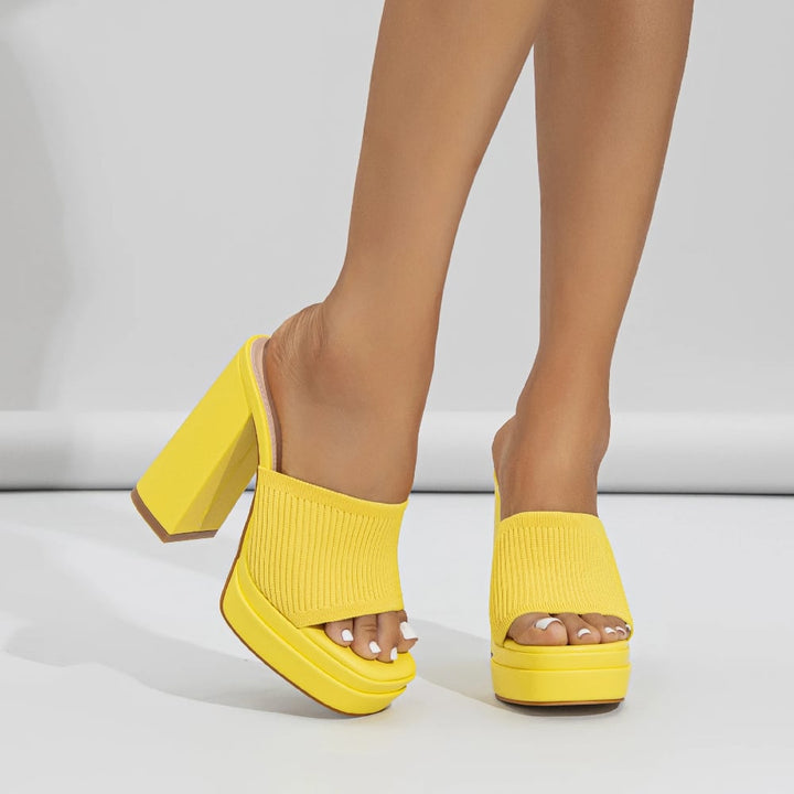 Side view of Merle platform sandals in yellow showing cushioned footbed