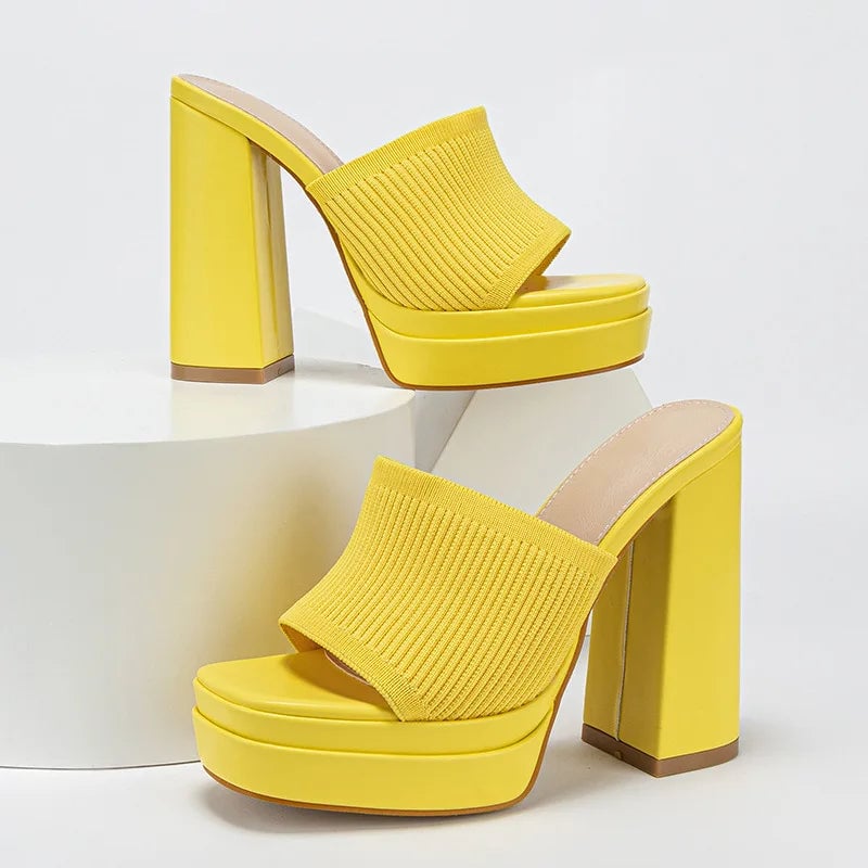 Close-up of buckle strap on Merle platform sandals in yellow