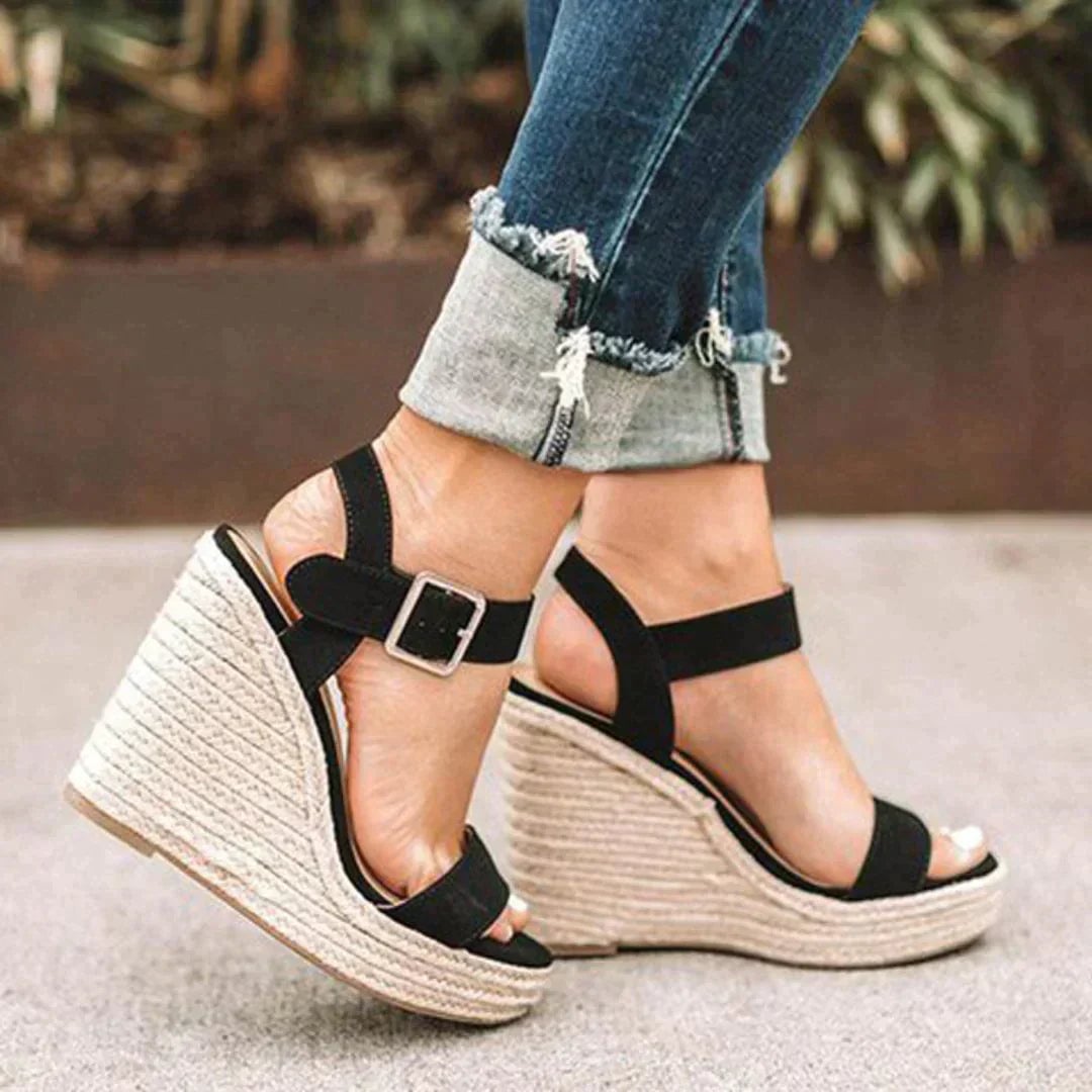 Women's woven espadrille wedge sandals with adjustable buckle ankle strap in black, side view