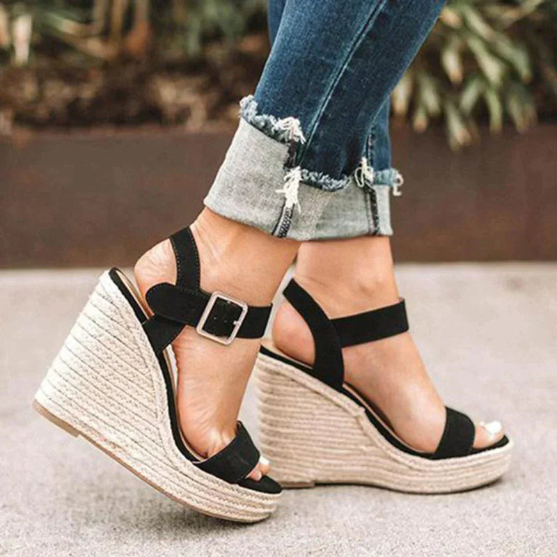 Women's woven espadrille wedge sandals with adjustable buckle ankle strap in black, side view