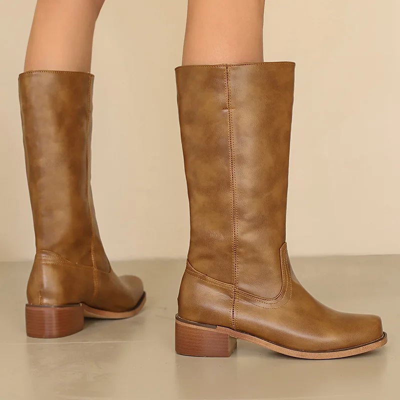 Women's orthopedic ankle boots in a neutral color with a smooth streamlined silhouette and cushioned sole
