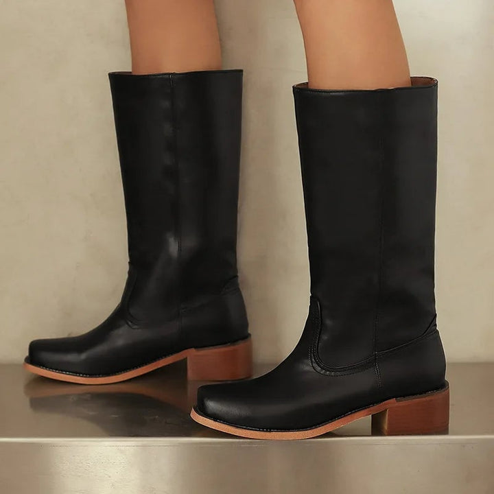 Flat lay of Mia orthopedic ankle boots showing heel and sole construction
