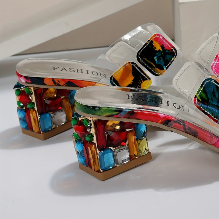 Overhead flat-lay of colorful orthopedic sandals on a light background showing full silhouette