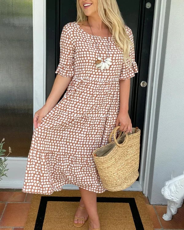 Flat lay of the dotted midi dress showing available color options including yellow, green, khaki, and blue