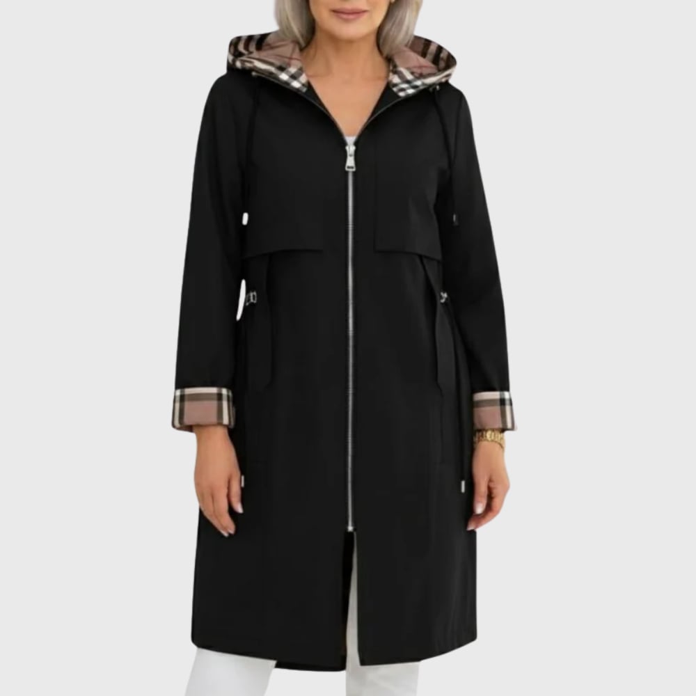 Close-up detail of the Mika lightweight trench coat showing buttoned cuffs and classic trench styling
