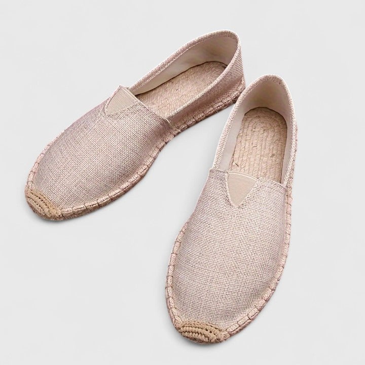 Side view of Mila women's white mesh espadrille flat showing braided jute rope trim detail