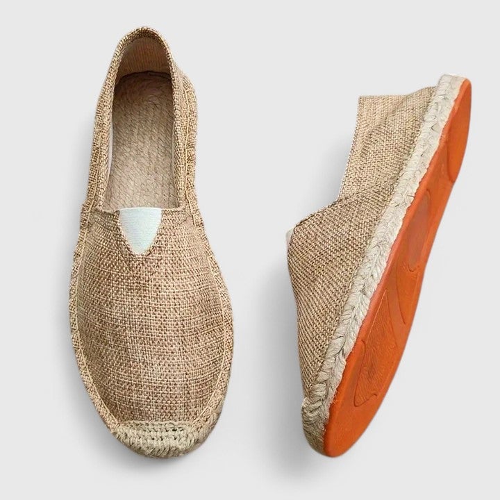 Mila espadrille flats in beige colorway on a light background, front three-quarter view