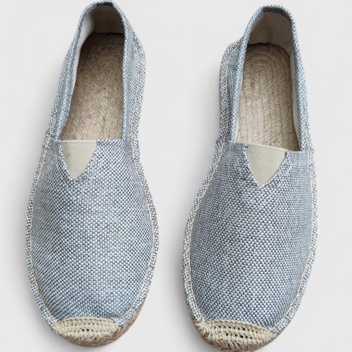 Close-up of the braided jute sole on Mila women's slip-on espadrille flat in black