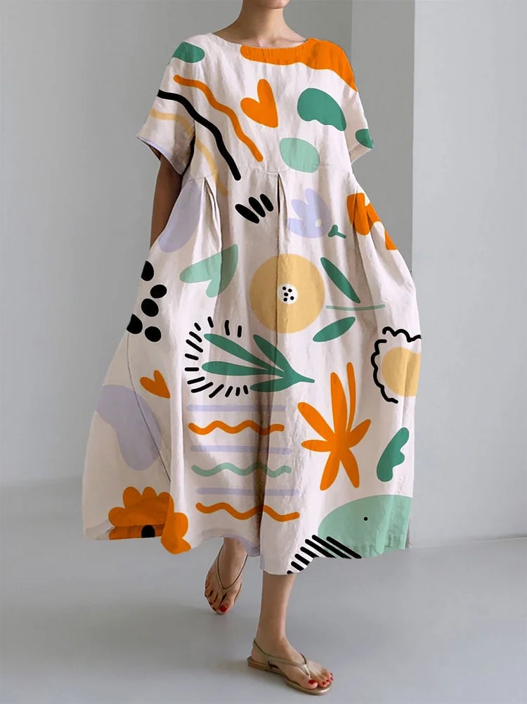 Woman wearing the Milena pink colorful long maxi dress with an artistic print, relaxed fit, and lightweight summer fabric