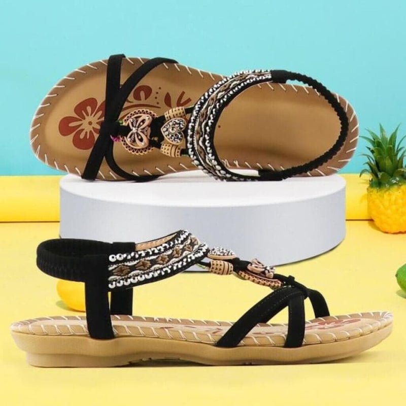 Millicent women's cushioned platform sandals in black with elastic strap detail, front three-quarter view