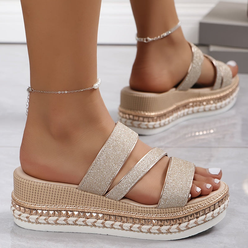 Top-down view of the Mira beige flat sandals showing the full footbed and strap layout