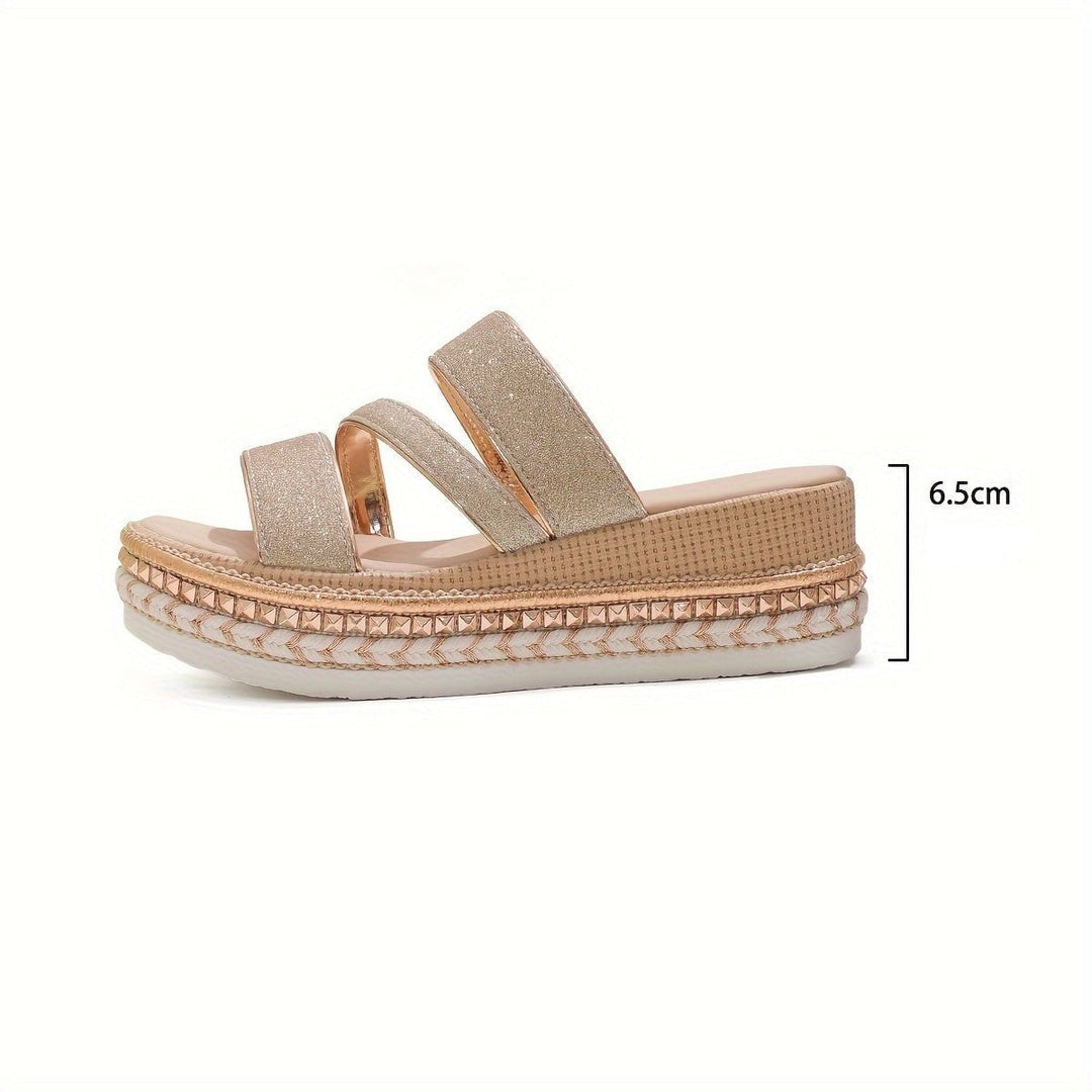 Pair of Mira beige women's flat sandals displayed together from a three-quarter angle