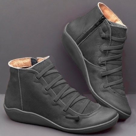 Women's support boot in red displayed on neutral background