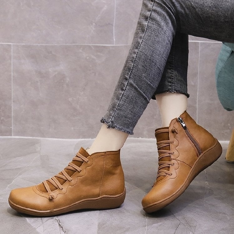 Women's support boot in black shown from heel angle