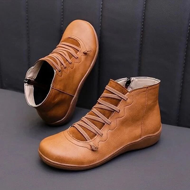 Women's support boot in red paired with casual leggings outfit