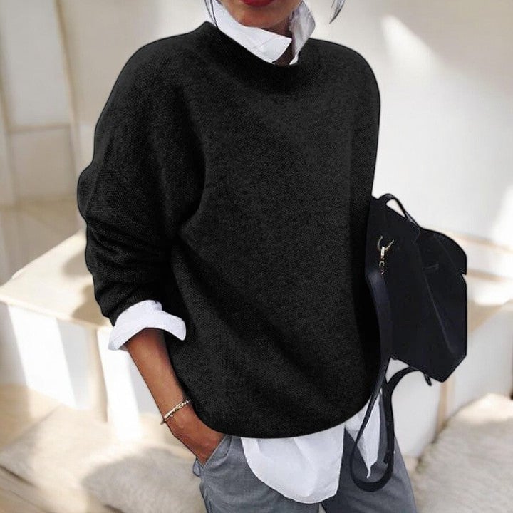 Woman wearing the Molly soft everyday sweater in Black with a relaxed, cozy fit