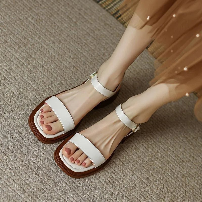 Molly vegan leather sandal in brown shown from the side highlighting clean minimalist silhouette