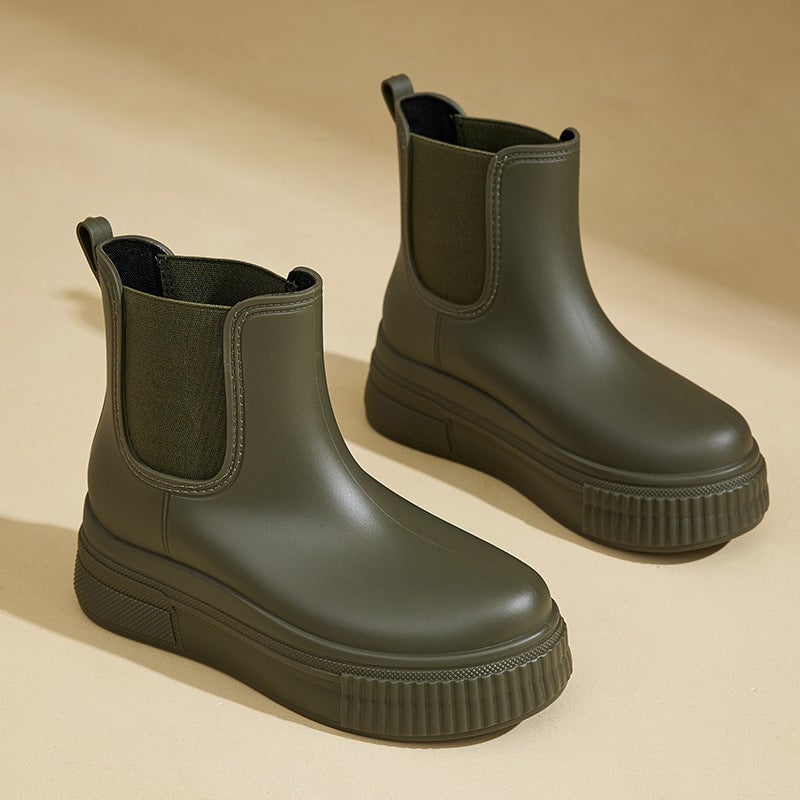 Mona waterproof rain boots in green with a sleek modern silhouette on a clean background