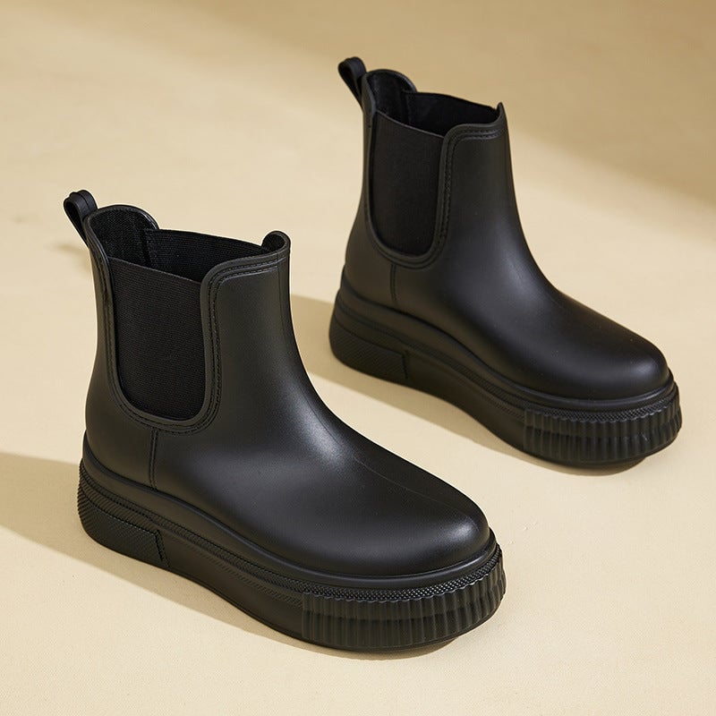 Mona rain boots in white stamped colorway styled with a casual outfit