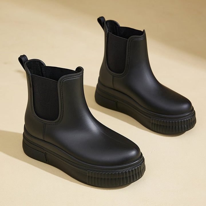Mona rain boots in white stamped colorway styled with a casual outfit