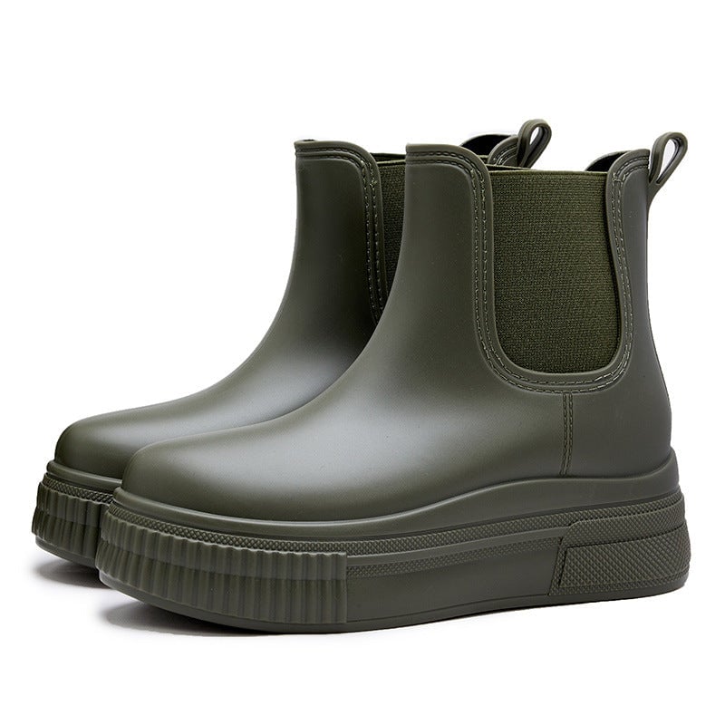 Side view of Mona rain boots in black highlighting the streamlined design
