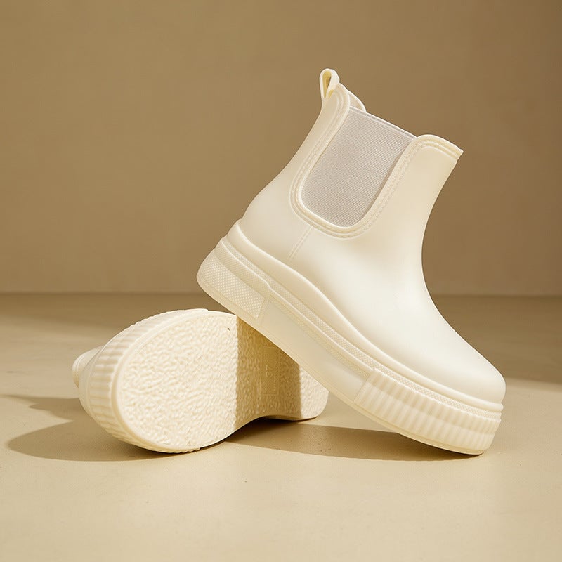 Mona rain boots in white stamped pattern from a three-quarter angle