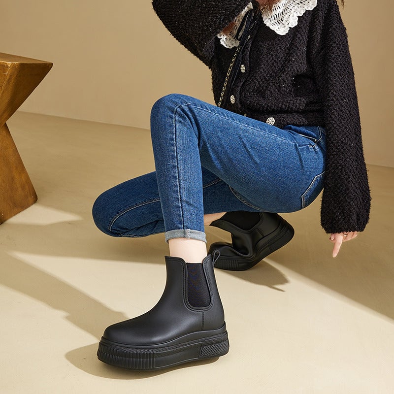 Flat lay of all three Mona rain boot colorways — green, white stamped, and black