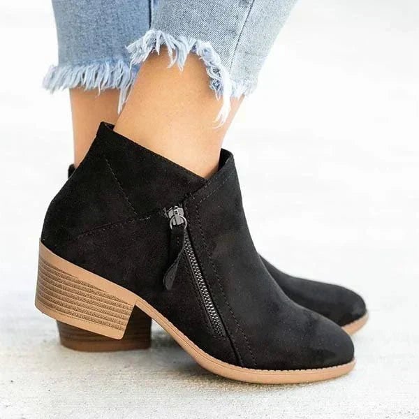 Mona ankle boots in orange colorway against a neutral background