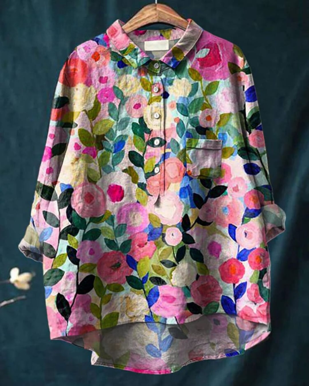 Model wearing a lightweight floral blouse in a delicate print, relaxed fit, front view
