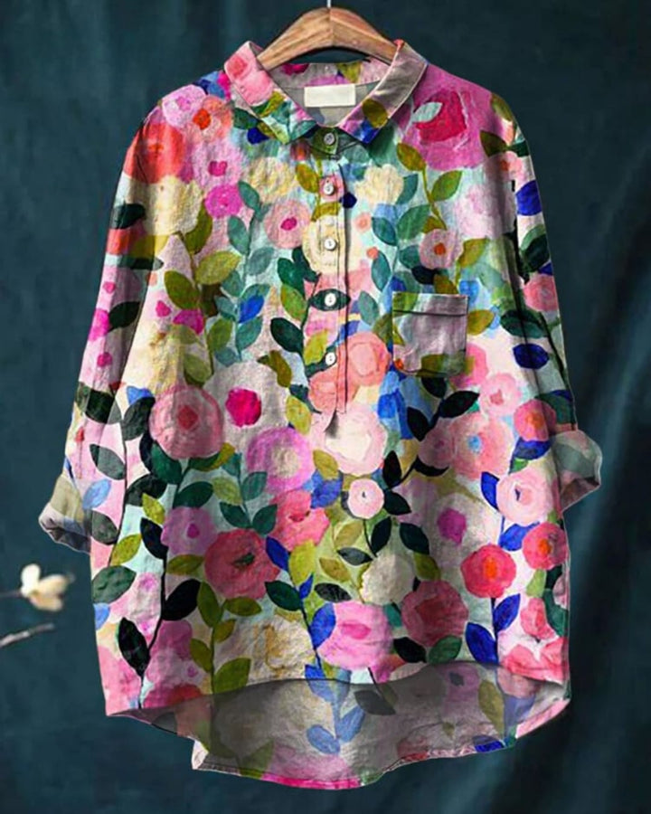 Model wearing a lightweight floral blouse in a delicate print, relaxed fit, front view
