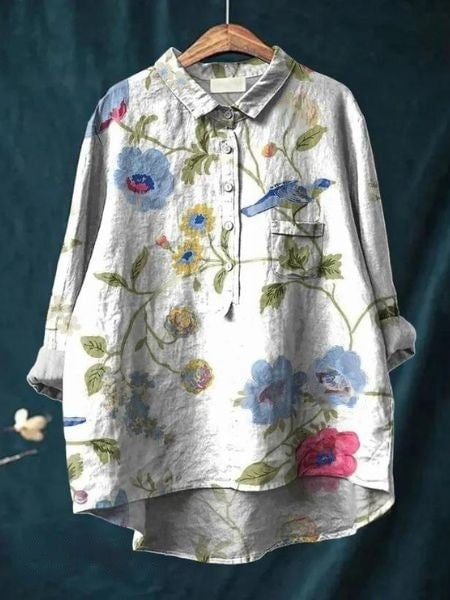 Flat lay of floral blouse showing full print pattern and silhouette