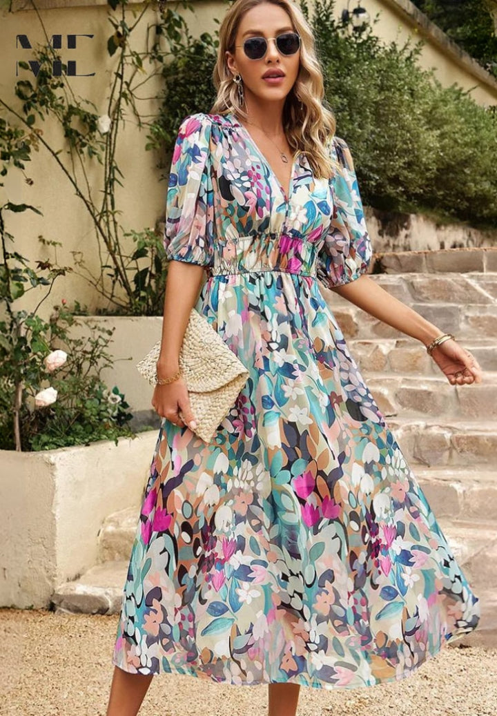 Close-up detail of the floral print fabric on the Monica dress showing soft, airy texture