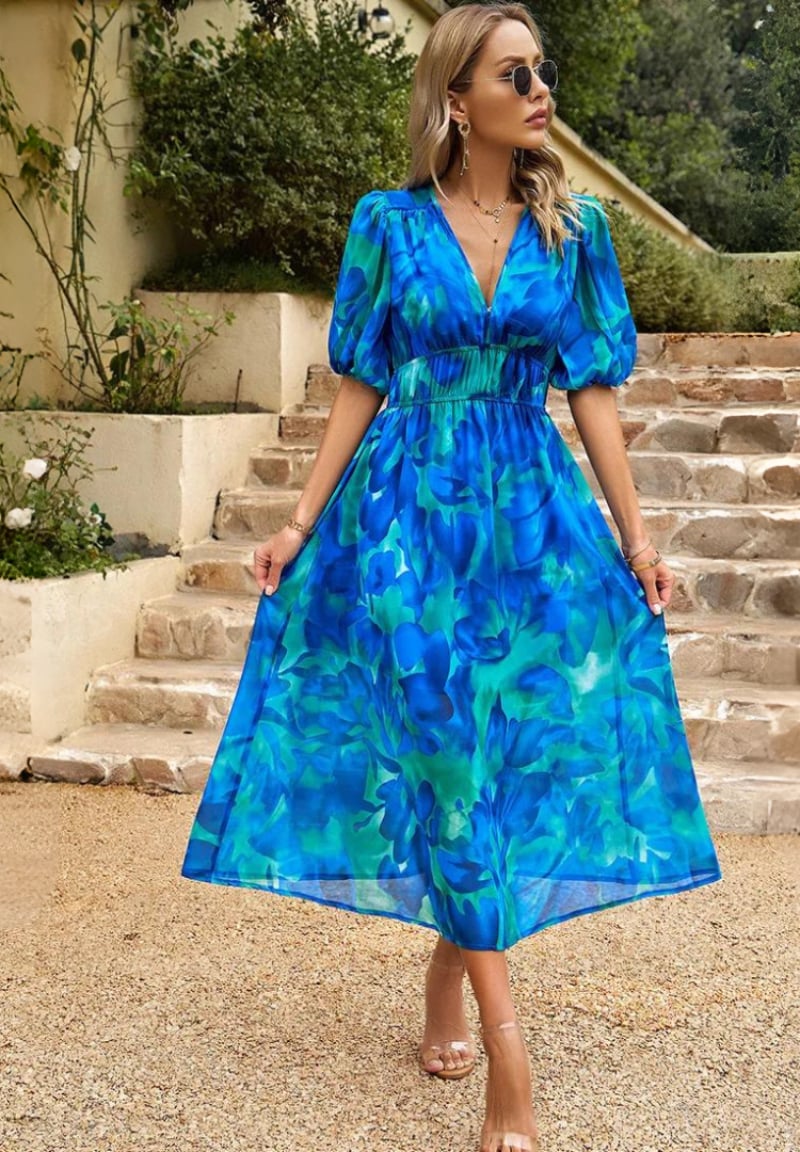Monica dress in blue colorway, flattering relaxed silhouette on a female model