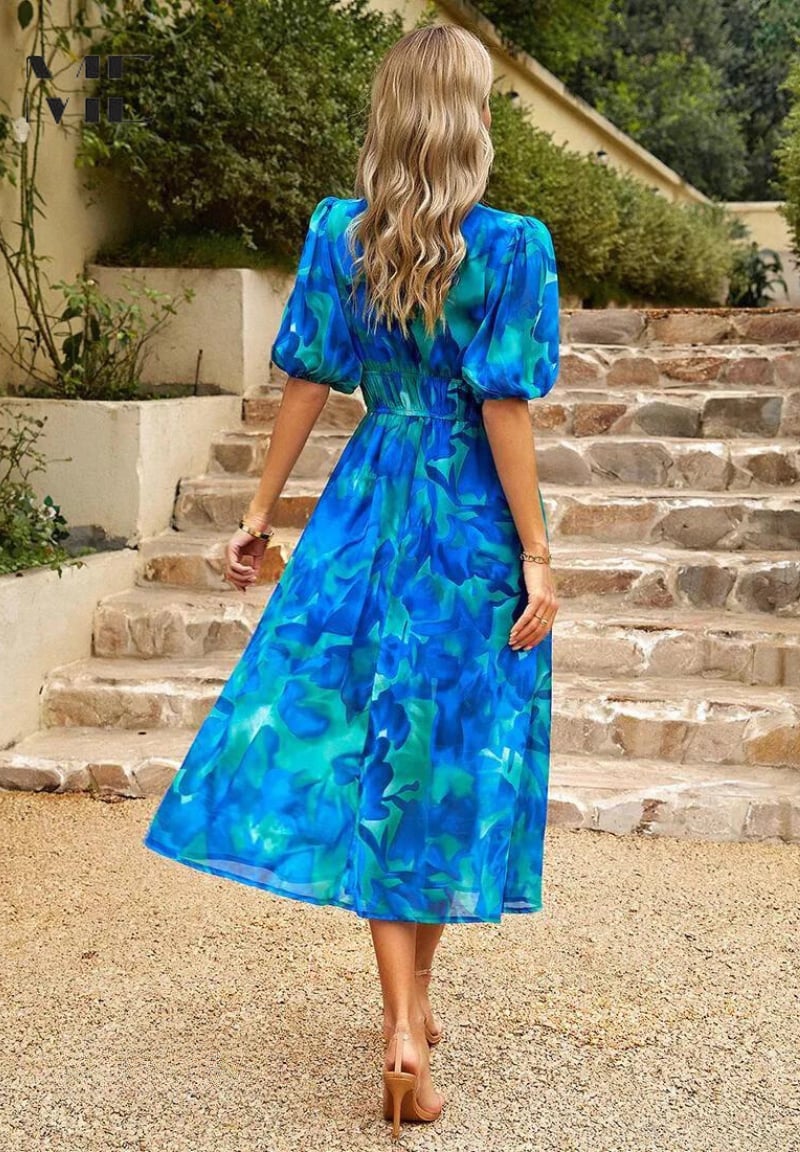 Monica dress in black colorway worn by a woman, elegant and versatile summer style