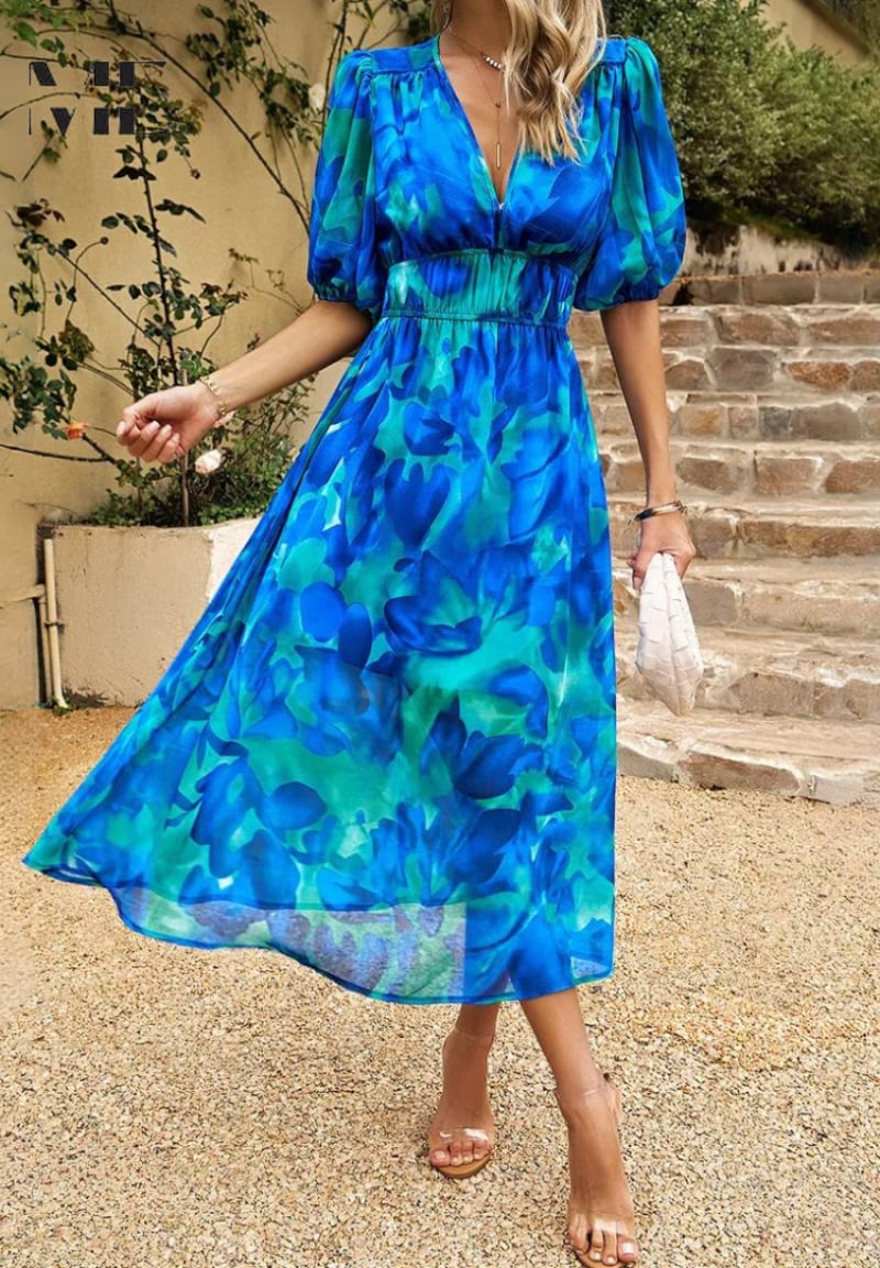 Side profile of the Monica floral dress highlighting the relaxed fit and subtle tummy coverage