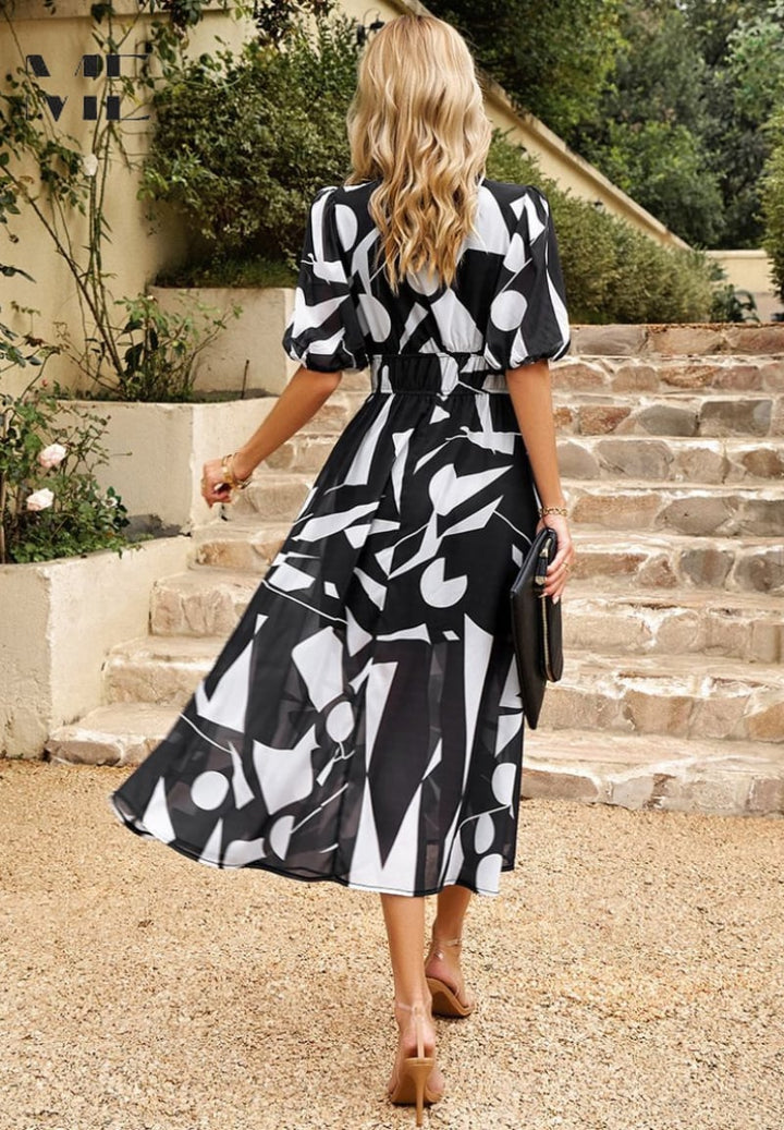 Woman twirling in the Monica elegant floral dress showing fluid lightweight fabric movement