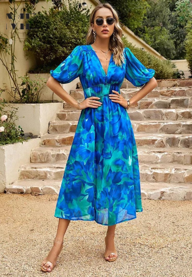 Full-length shot of woman in Monica floral dress standing outdoors in natural light