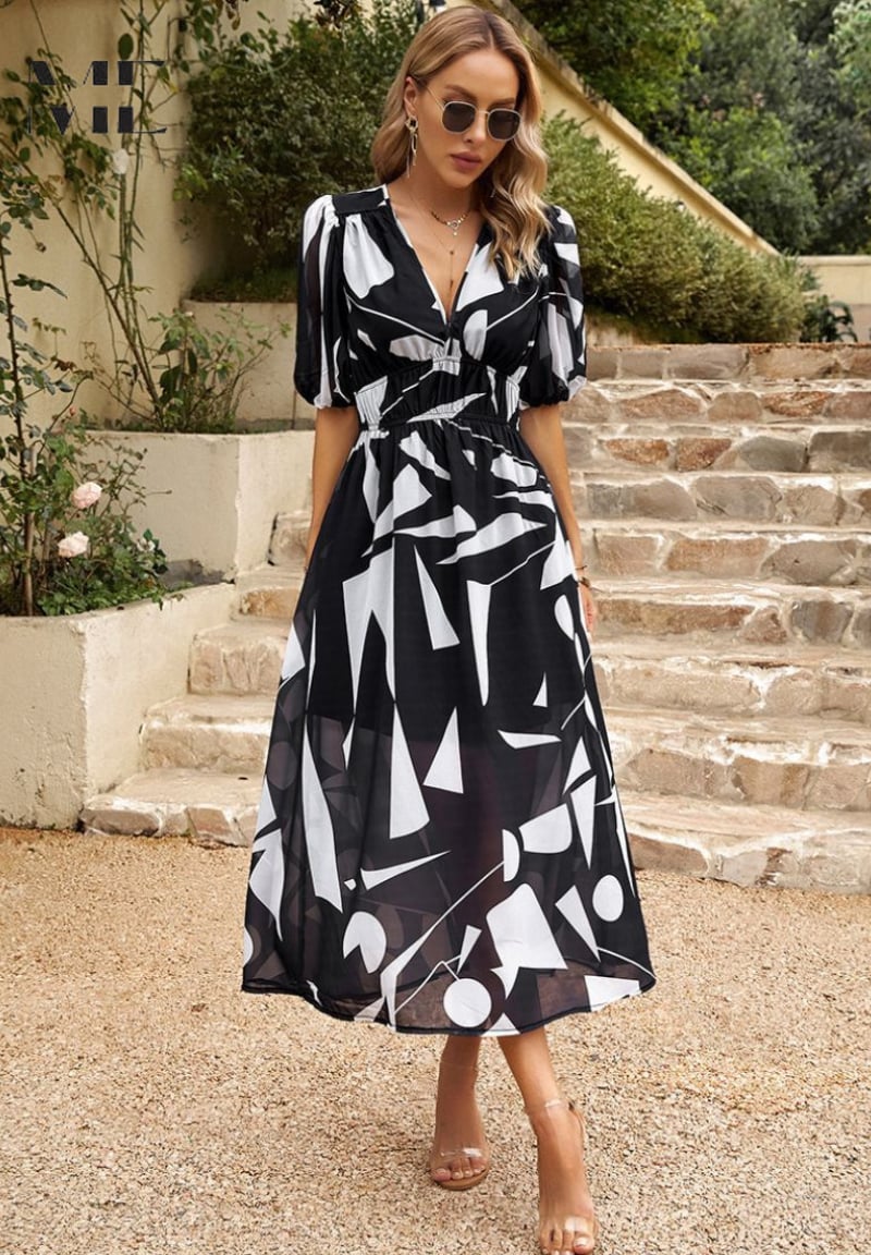 Monica elegant floral dress styled with a woven tote bag and strappy sandals