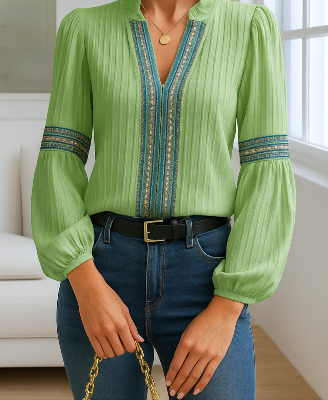 Blue vintage V-neck blouse with breezy flowing fit shown on a model
