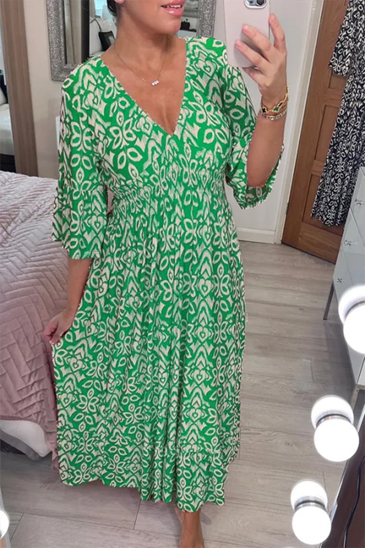 Side profile of the Monroe long dress in green, showing the flattering fit and lightweight flowing movement